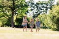 Three happy kids holding hands and running Royalty Free Stock Photo