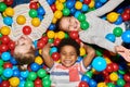 Three Happy Kids Playing in Ballpit Royalty Free Stock Photo