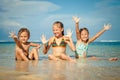 Three happy kids playing on beach Royalty Free Stock Photo