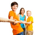 Three happy kids pull the rope