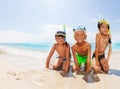 Boys on the sea beach before diving in scuba masks Royalty Free Stock Photo