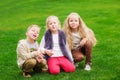 Three happy little kids chew gum Royalty Free Stock Photo