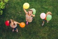 Three happy little kids playing with colorful balloons Royalty Free Stock Photo