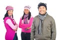 Three happy models in winter clothes