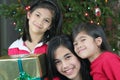 Three happy sisters with presents Royalty Free Stock Photo