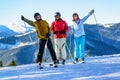 Three happy skiers having fun on winter ski slope Royalty Free Stock Photo