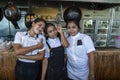 Three happy thai female chefs at a beach restaurant on island Koh Phangan, Thailand