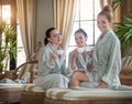 Three happy women drinking tea at spa resort Royalty Free Stock Photo