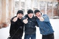 Three happy young men showing thumb up Royalty Free Stock Photo