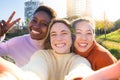 Three happy young women friends taking a selfie. International students having break during classes Royalty Free Stock Photo