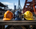 Three hard hats with a design on a step ready for a day of construction work., construction and engineering image Royalty Free Stock Photo