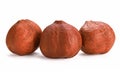 Three hazelnuts isolated on white background, close up. Royalty Free Stock Photo