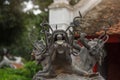 Three headed dragon made of bronze with glass ball in their mouth on the top of the antique incense burner at Temple of Literature Royalty Free Stock Photo