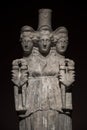 Three headed roman-asian ancient statue of beautiful women at bl Royalty Free Stock Photo