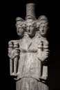 Three headed roman-asian ancient statue of beautiful women at bl Royalty Free Stock Photo