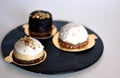 Three healthy raw cupcakes served on a round black tray