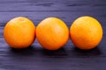 Three healthy orange fruits.