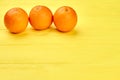 Three healthy orange fruits.