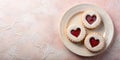 Three heart-shaped jam cookies on a plate with powdered sugar. Generative AI Royalty Free Stock Photo
