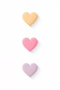Three hearts of different colors are shown on a white background Royalty Free Stock Photo