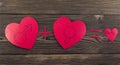 Three hearts on a wooden background heart Royalty Free Stock Photo