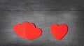 Three hearts on a wooden background Royalty Free Stock Photo