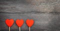 Three hearts on a wooden background Royalty Free Stock Photo