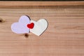 Three hearts on wooden background. Valentine Day, family, wedding love concept Royalty Free Stock Photo