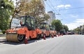 Three heavy road vibrating roller seals ready for road repair in a modern city