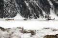 Three helicopters on a row in the airport of St Moritz Switzerland in the alps