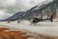 Three helicopters on a row waiting to take off in the alps switzerland