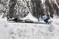 Three helicopters in the snow covered landscape in the alps switzerland