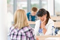 Three high school students in classroom Royalty Free Stock Photo