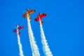 Air-show acrobatics in Avalon with three highly coloured stunt planes
