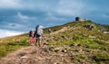 Three hikers walking in the mountains