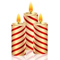 Three holiday candles