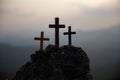 The three holy crosses of Jesus Christ shining through the red sky and clouds and bright rays background. Silhouette cross on Royalty Free Stock Photo