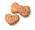 Three homemade oatmeal heart cookies with nuts and raisins