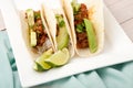 Three homemade soft tacos with ground meat