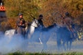 Three horse riders in fume. Royalty Free Stock Photo