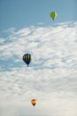 Three hot air balloons at a balloon rally. Royalty Free Stock Photo