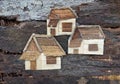 Three houses collage art.Made by wooden material.Sculpture