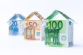Three houses made of bank notes Royalty Free Stock Photo