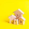 Three houses and people on a yellow background. Buying and selling of real estate, construction. Apartments and residential Royalty Free Stock Photo