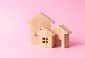 Three houses on a pink background. Buying and selling of real estate, construction. Apartments and residential buildings in a city Royalty Free Stock Photo