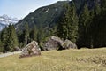 Three huge stones covered with moss close to the tourist path towards to Murg lakes Royalty Free Stock Photo