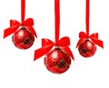 Three hunging red christmas balls isolated