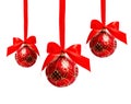 Three hunging red christmas balls isolated