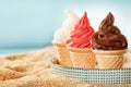 Three ice cream cups served on a tray on the beach Royalty Free Stock Photo