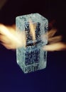 three ice cubes against the background of fire, fire and ice, place under the text Royalty Free Stock Photo